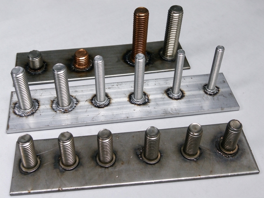 Finished metal stud welded to a steel plate with the weld base visible for inspection